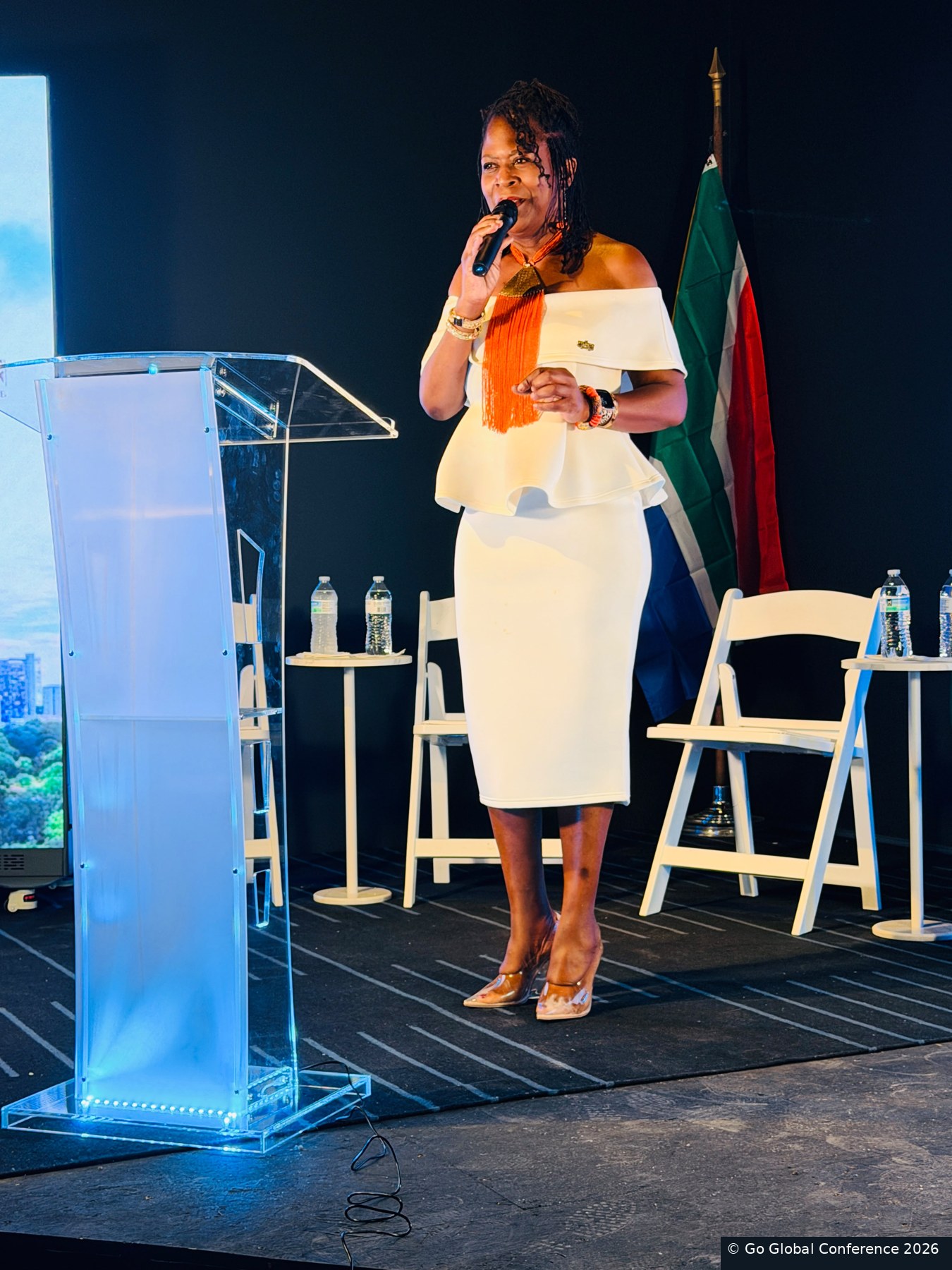 A speaker addressing reception guests · GGC 2026