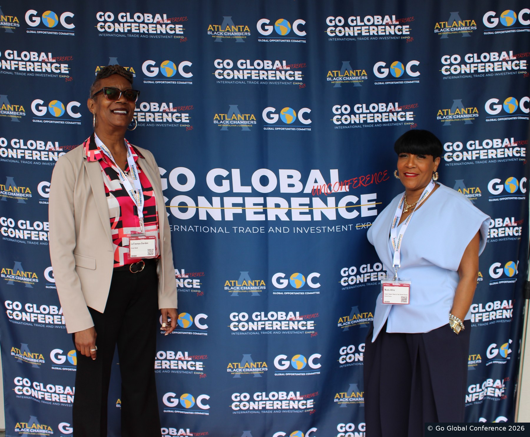 Delegates posing at the conference backdrop · GGC 2026