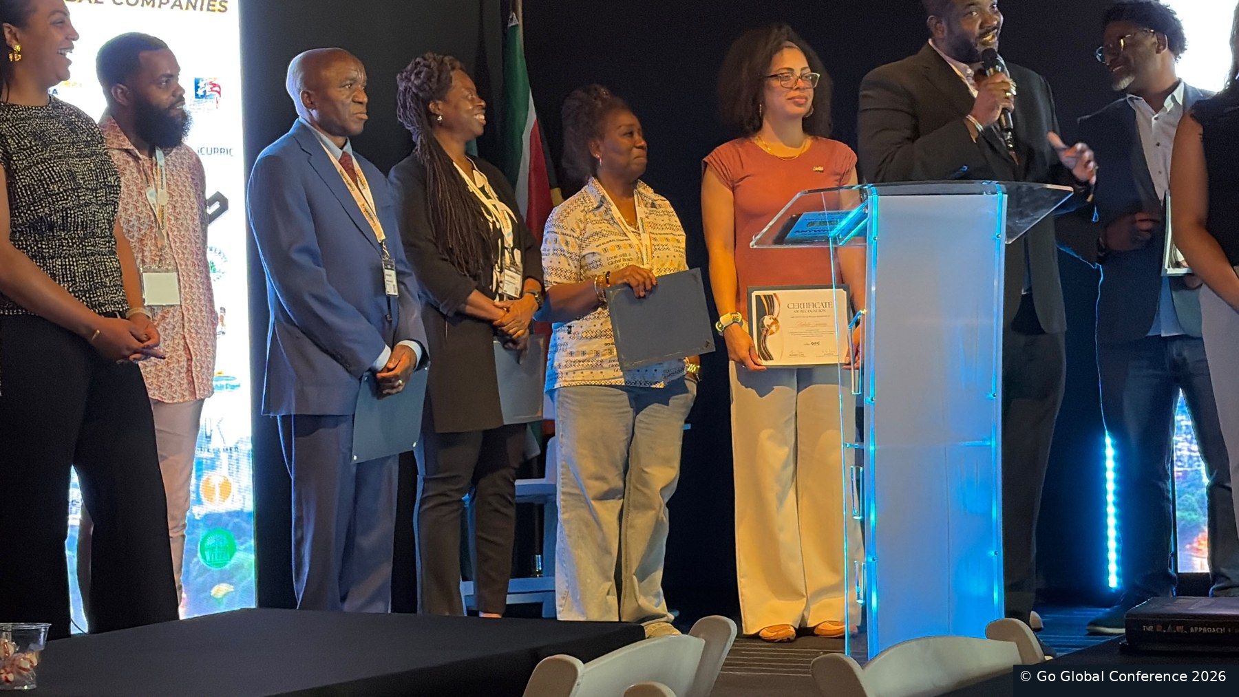 Partners celebrating on stage · GGC 2026